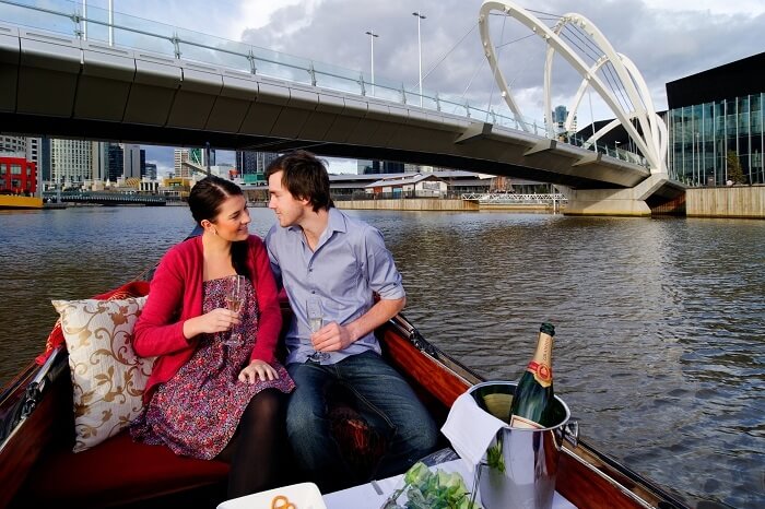Couple cruising through Yarra River