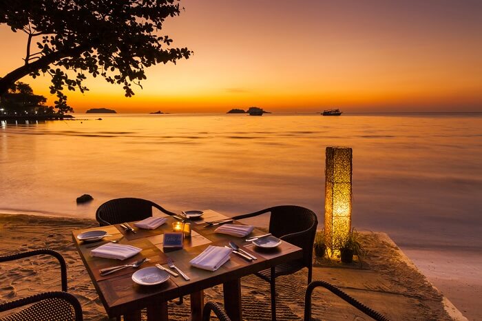 Romantic sunset on the beachfront cafe of a Koh Chang in Thailand