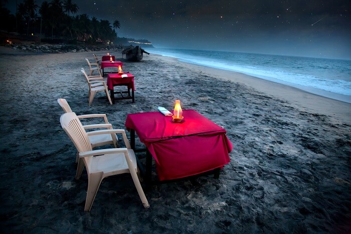 Romantic tropical cafe on the beach near the ocean in Varkala