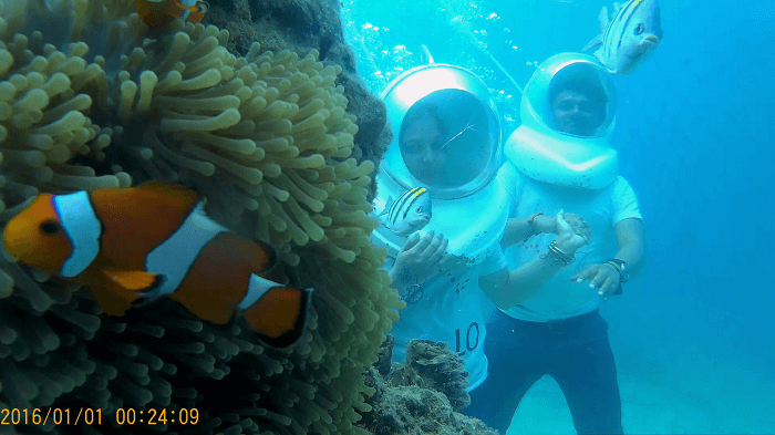 Couple enjoying Underwater seawalking in Andaman