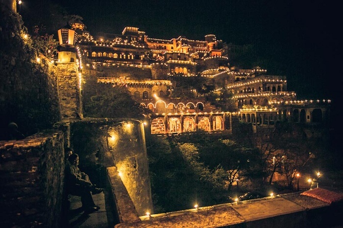 A distant shot of Neemrana Fort lit up for a wedding