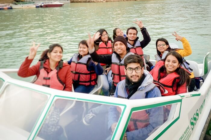 A group of tourists enjoy a speed boat ride in Tehri Dam at Kanatal