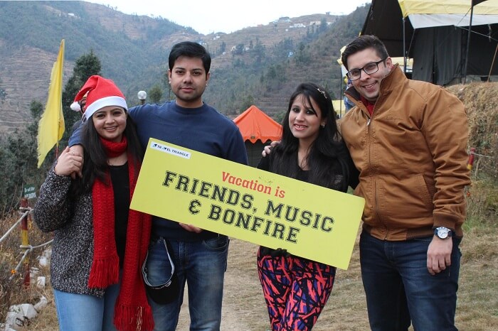 Travelers pose in front of the campsite on their trip to Dhanulti