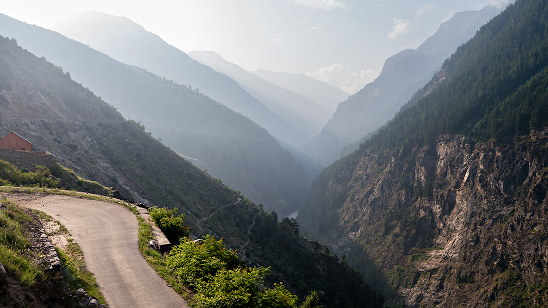 a road with a beautiful view of mountains