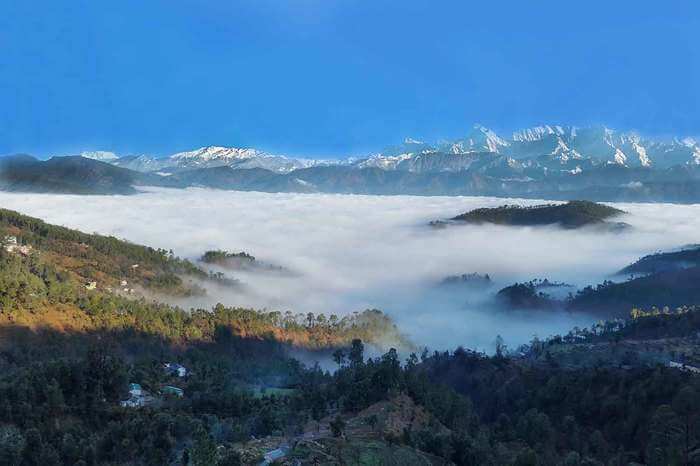 mountains covered under fog