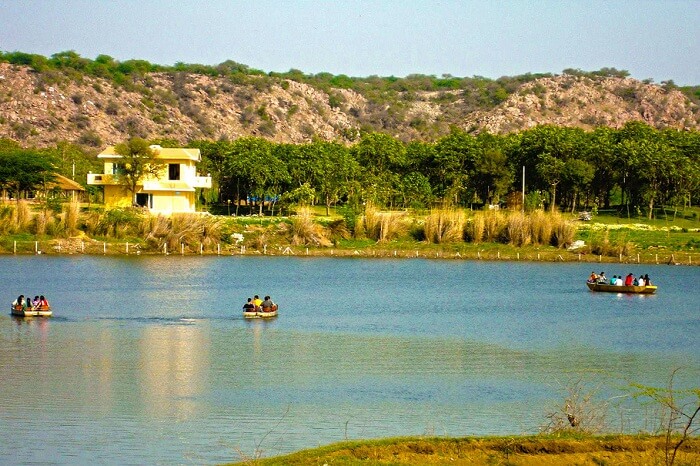 Tourists boating in the Damdama Lake that is one of the weekend getaways near Gurgaon