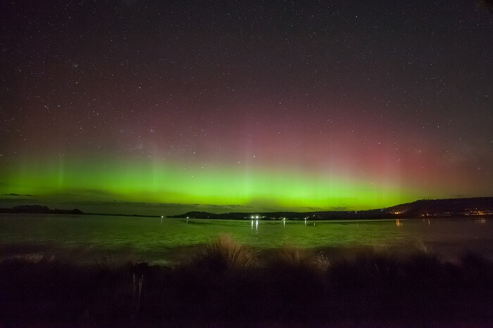 Beams of Aurora Australis over Cremorne Beach at Hobart