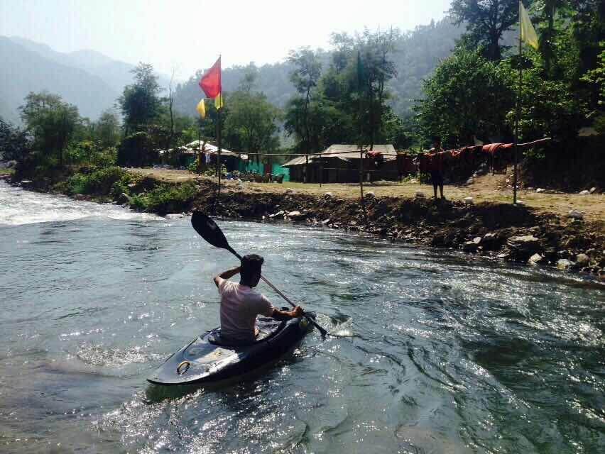 a man rowing a boat in waters
