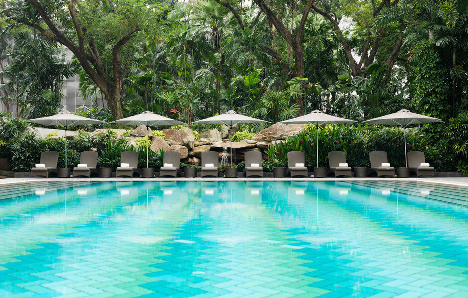 outdoor pool area with cabanas