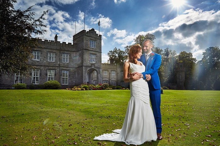 A couple poses for a wedding shoot at Luttrelstown Castle in London