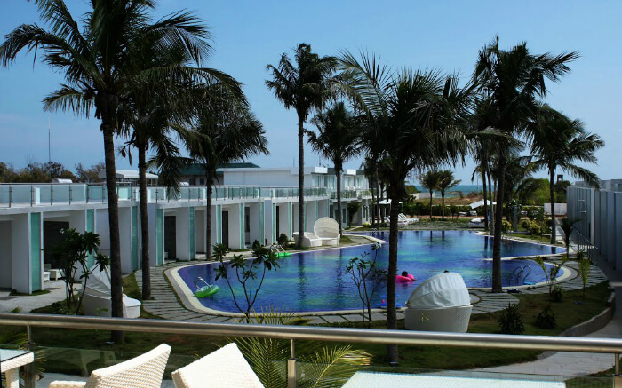 Dining area overlooking pool at L’attitude in Mahabalipuram in Chennai