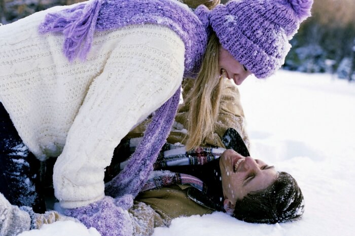 Couple playing in snow in Himachal