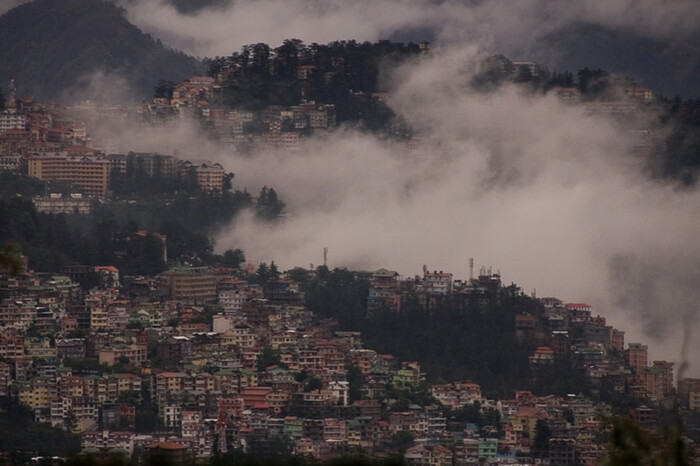 Top view of Shimla city covered in mist