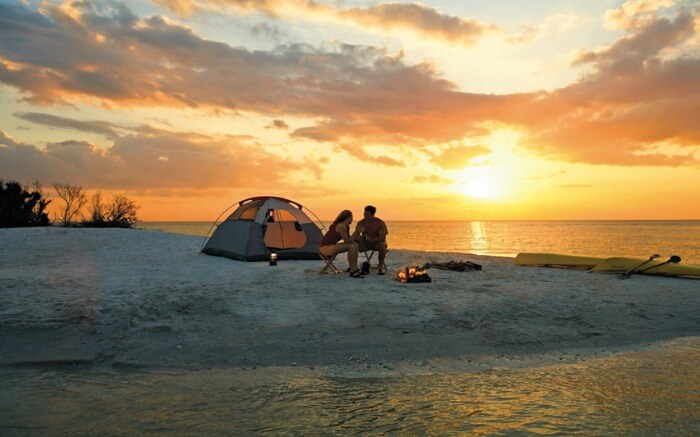 A couple camping on a beach