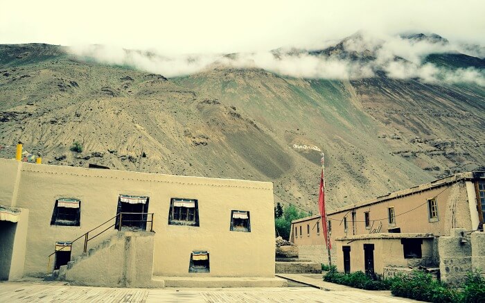 Inside Tabo monastery in Spiti along with barren mountains background