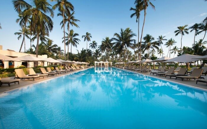 a Zanzibari thatched roof villas in a resort