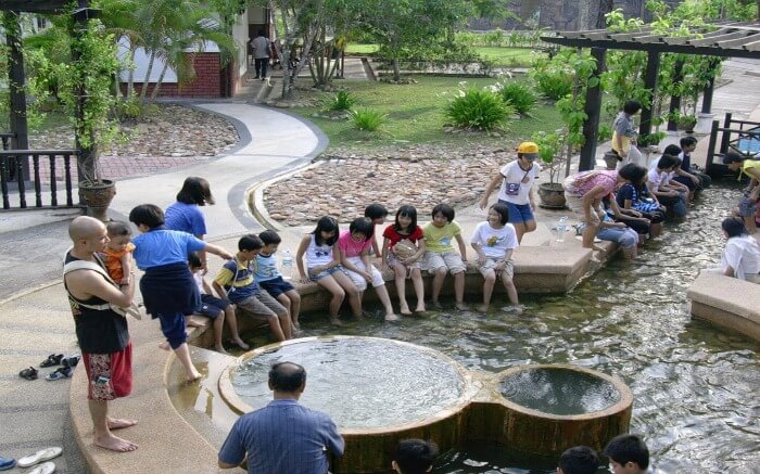 kids having fun in hot water spring in Langkawi