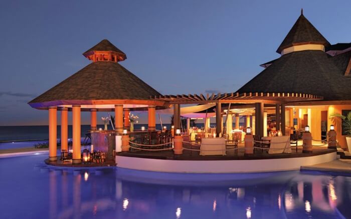 A hutlike resort in Jamaica at night