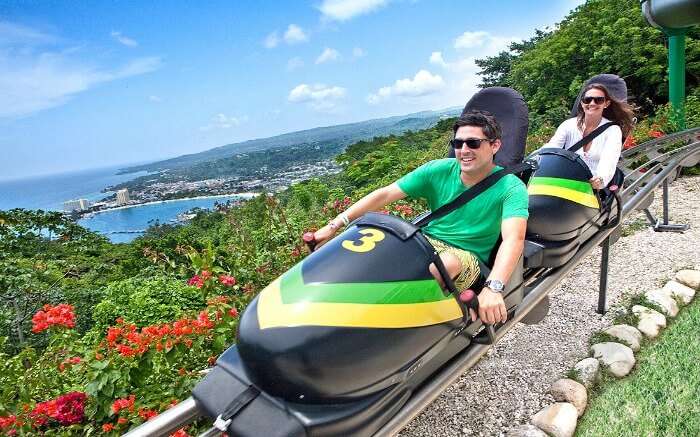 Couple taking a ride in sky explorer at Mystic Mountain