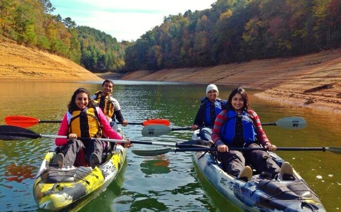 Couples in river ready for Kayaking