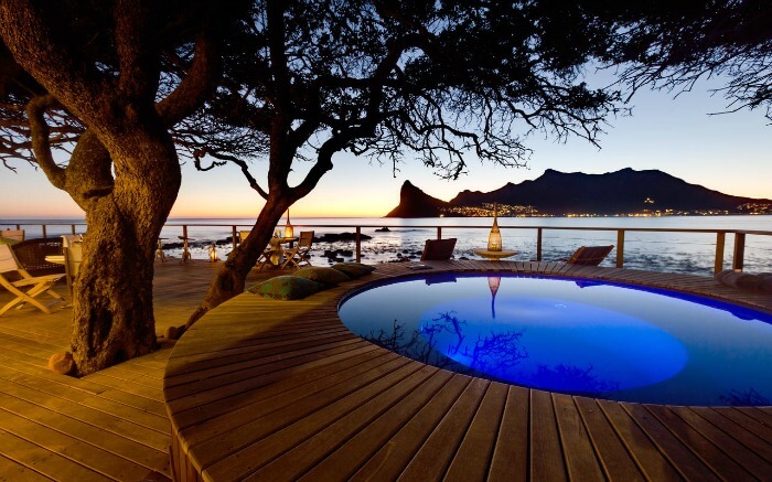 The deck view of a romantic pool close to the Atlantic Ocean in South Africa