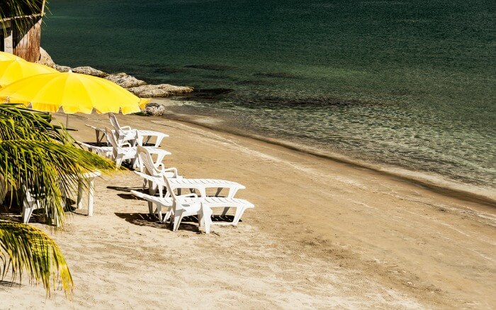 Yellow parasol recliners on Subic Bay beach