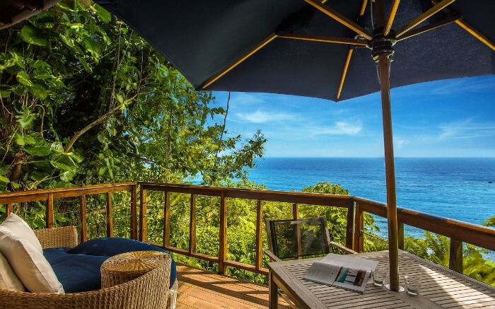 a balcony of a resort overlooking the sea 1