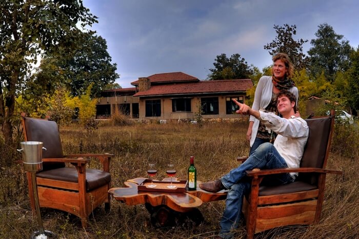 Couple at the private seating space of King's Lodge in Bandhavgarh