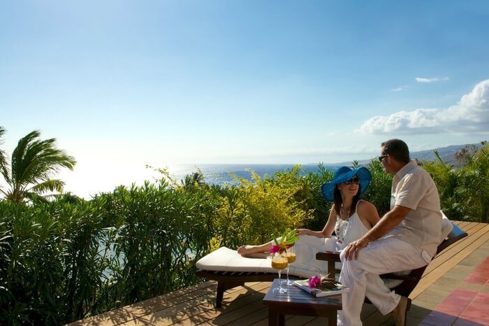 Couple spending private moments sitting in a resort in Reunion Island