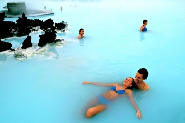 Couple enjoying romantic moments in a lagoon in Iceland