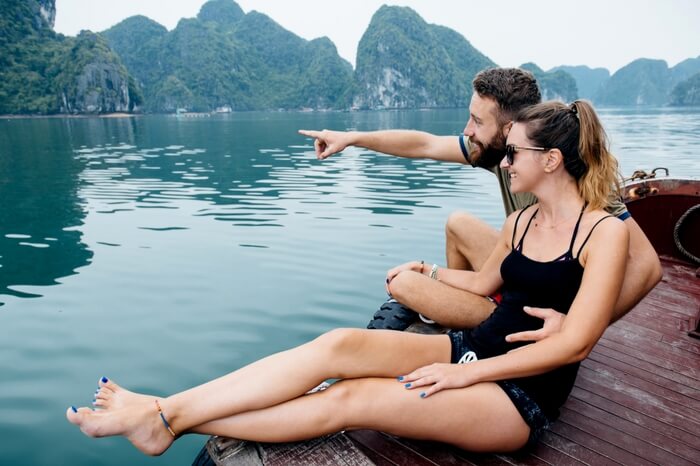Couple relaxing on a boat in Vietnam