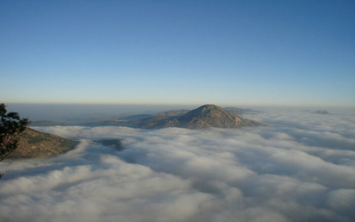 hills covered by clouds