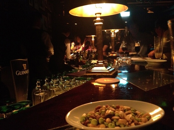 Guests enjoying drinks and snacks at the JJ's Bar in Amman