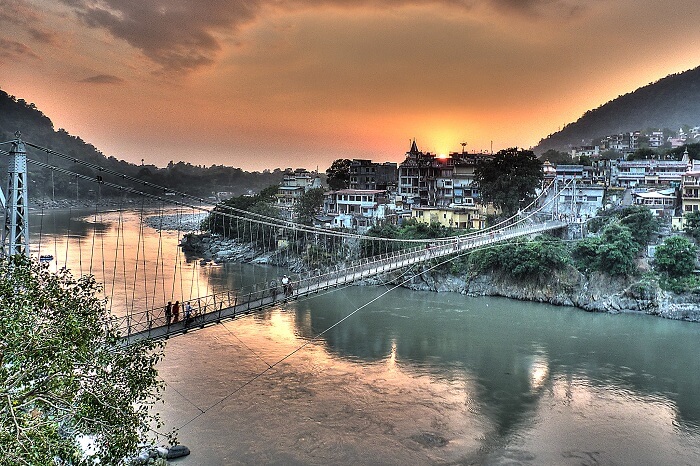 A sunset view of the Laxman Jhula and the city of Rishikesh