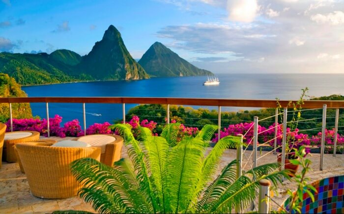 open terrace of a resort overlooking the gorgeous Caribbean sea and volcanic mountains1