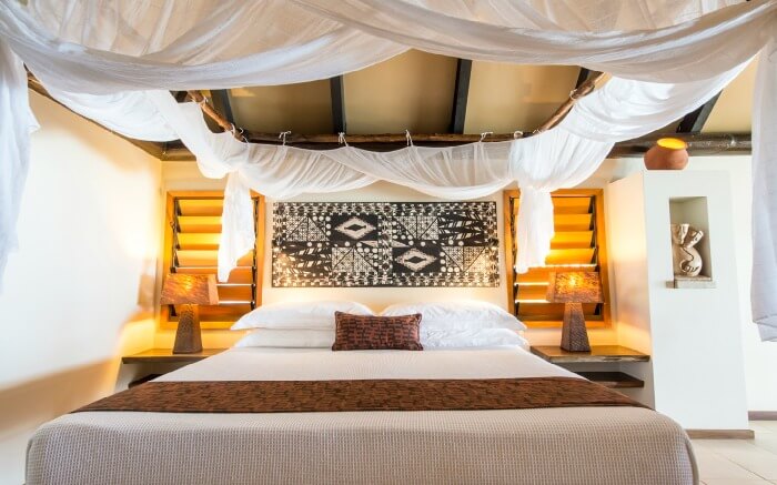 A lavish bed decorated with traditional art