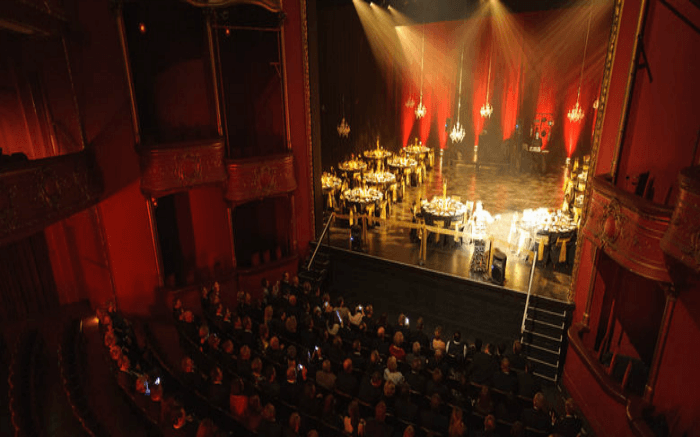 A show in progress at the Opera House as people watch on