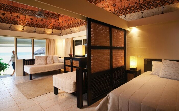 A stylish hotel bedroom decorated with traditional ar