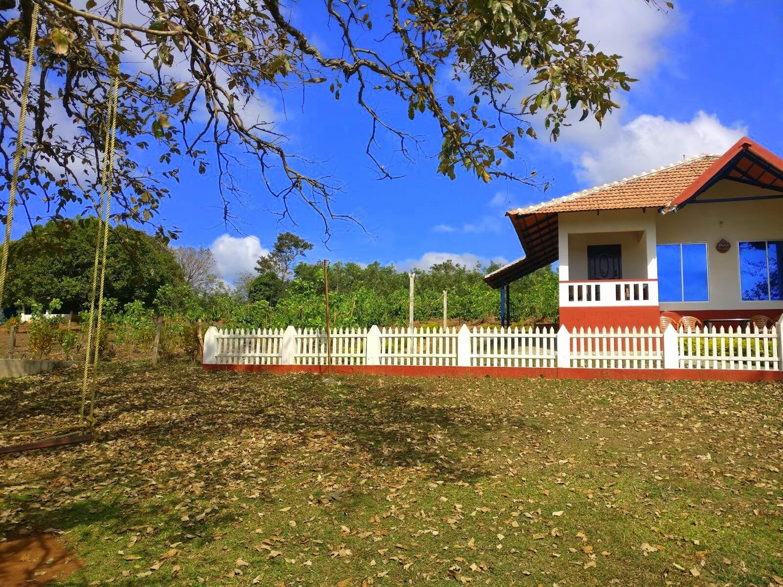 a beautiful home with fences and a big garden