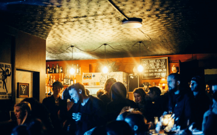 People celebrating and drinking at Darkroom in Christchurch in New Zealand