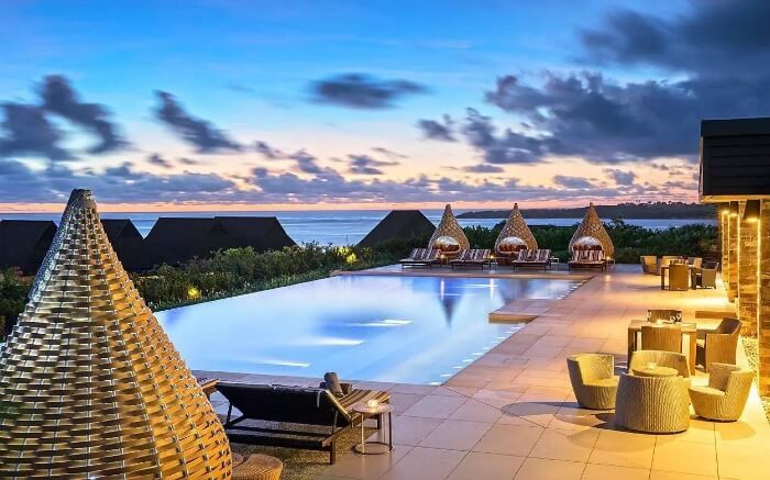Stylish bamboo cabanas near an infinity pool in a resort1