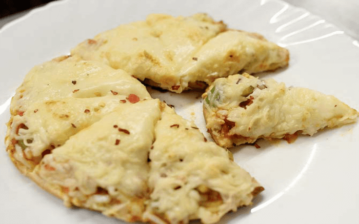 cheesy pizza slices on a plate