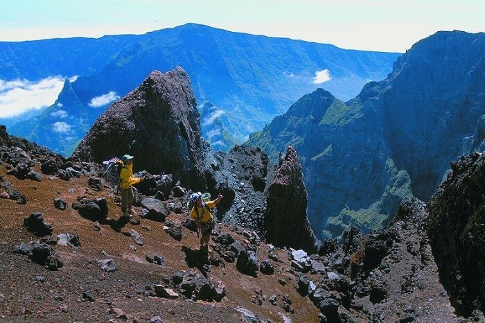 A couple trekking in Mafate on a honeymoon in Reunion Island