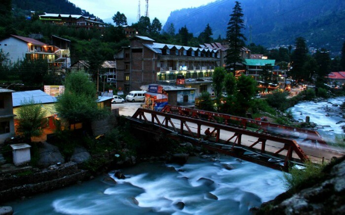 A stream flowing past the market area in Old Manali