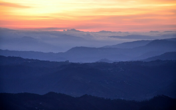 Orange sky after sunset in the mountains