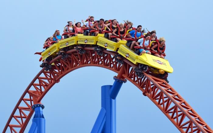 People enjoying on a roller coaster ride