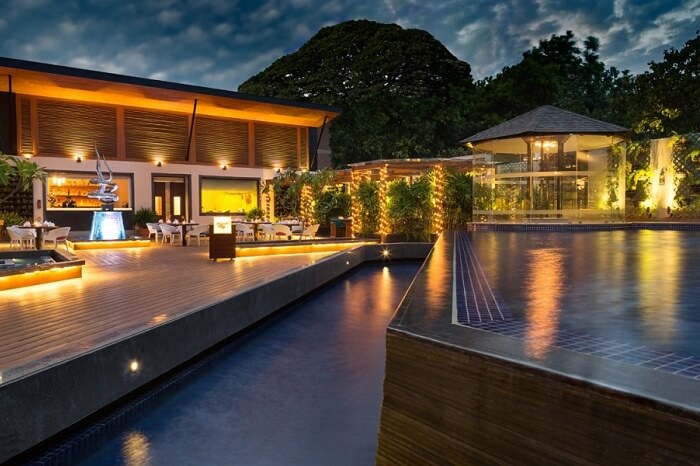 An evening shot of the poolside restaurant at The Residency Hotel