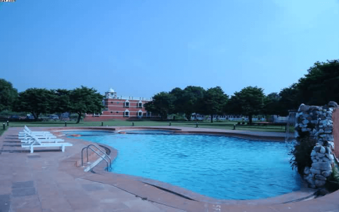 Poolside view of Aum Health Resort in Vadodara