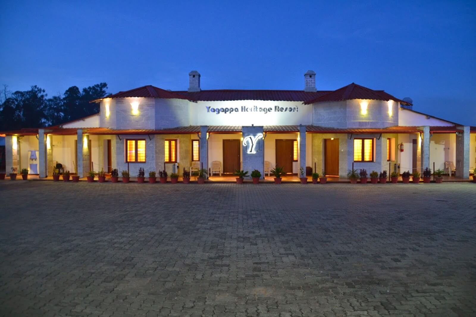 Well lit Yagappa Heritage Resort at night
