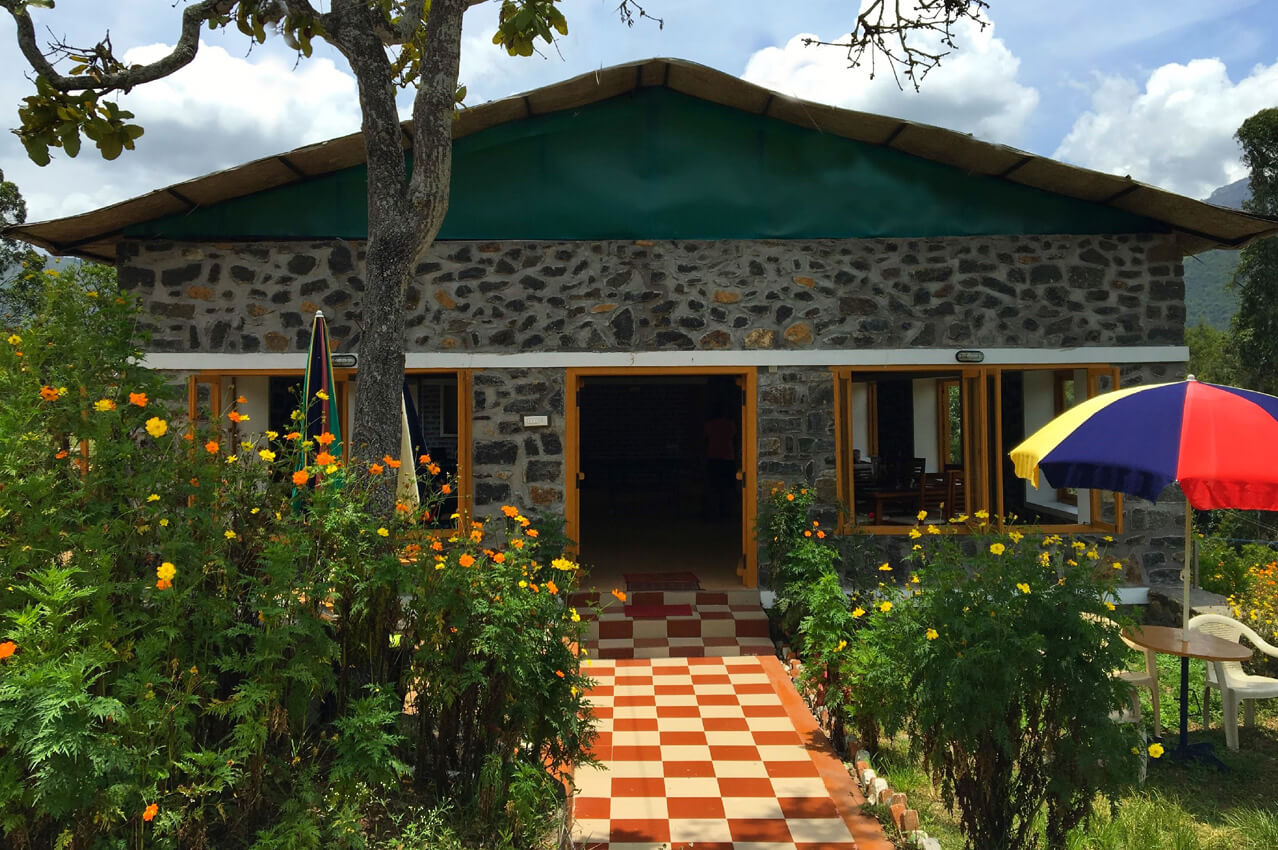 a cottage surrounded by a beautiful garden